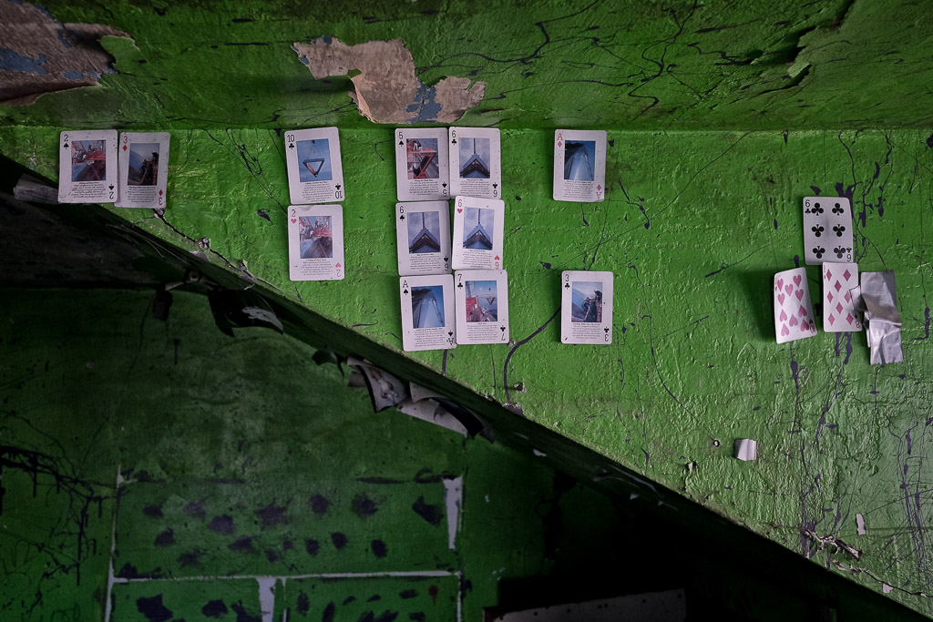 Something I found on the wall of an otherwise uninteresting abandoned farmhouse in rural Iowa.  The cards with the photos all tell the story of the St. Louis Arch.  This was in the same room as the wall art in another photo.